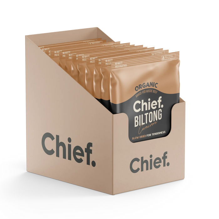 Cardboard display box filled with packs of organic Chief Biltong, showcasing a modern design.