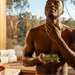 Dark-skinned man applying Aftershave Tallow Balm in sauna setting
