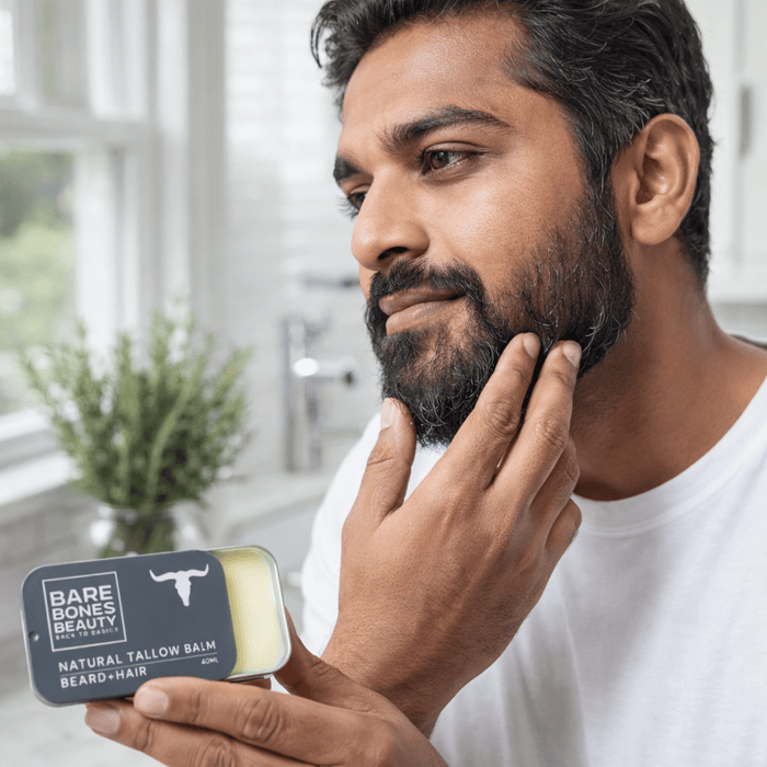 Man applying Bare Bones Beauty Beard Tallow Balm - 40ml to his beard in a bright natural light setting