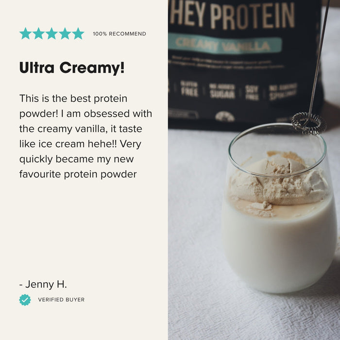 Glass of creamy vanilla shake made with Grass-fed Whey Protein Powder - Creamy Vanilla - 900g by Chief displayed with whisk and product pack.