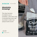 Hand scooping Chief Grass-fed Whey Protein Powder - Unflavoured - 900g bag next to blender in kitchen setting