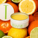 Open tin of Sicillian Citrus Tallow Balm - 70g by Tuttofare surrounded by sliced citrus fruits for skincare collection