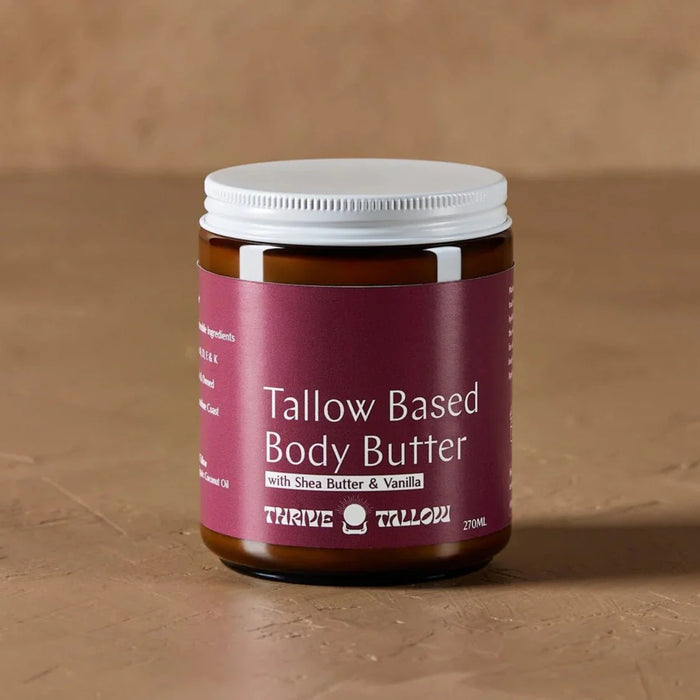 Tallow Based Body Butter - 270ml by Thrive Tallow in amber jar with white lid on brown surface background